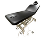 Angled view of the 2-section electric treatment table in a fully flat position, highlighting its sturdy white scissor-lift base and comfortable black cushioning.
