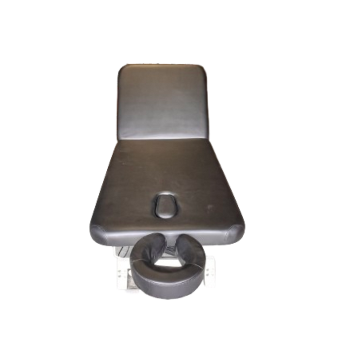 Top-down close-up view of the contoured headrest section on the 2-section electric facial massage table, featuring a built-in face hole for optimal client comfort during prone treatments.