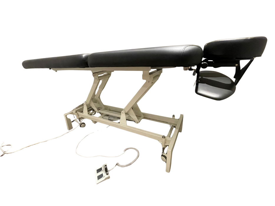 Side profile view of the flat 2-section electric height control treatment table, demonstrating its sleek profile and durable lifting structure designed for professional use.