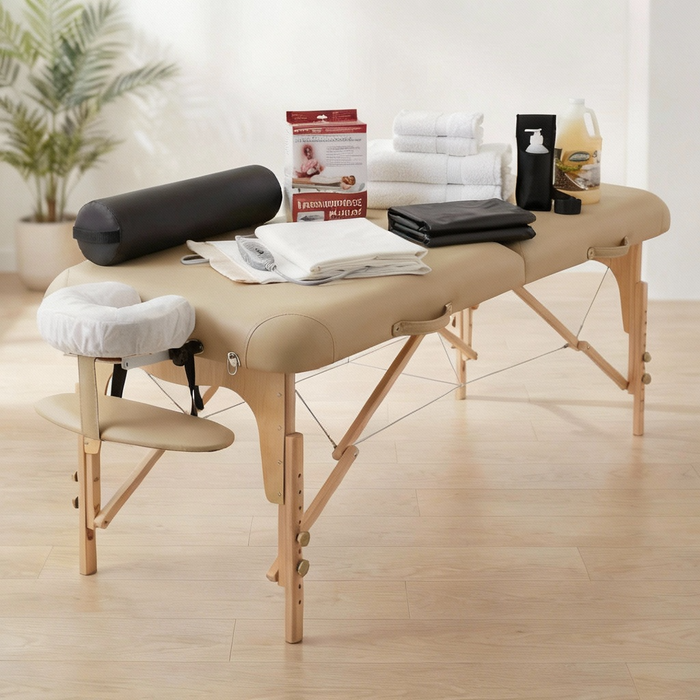 Massage table with accessories on a wooden floor in a room with plants