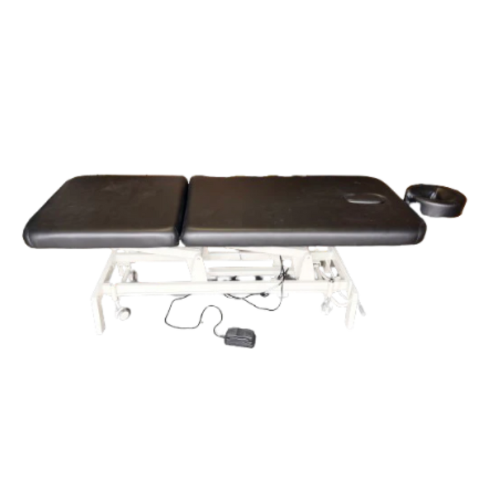 A view of the table's undercarriage highlighting the electric motor, control cables, and sturdy base supports.