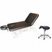 Angled view of the A-LEK facial massage treatment bed with the backrest section smoothly elevated, designed for versatile spa and esthetic services, shown alongside the complementary practitioner saddle stool.