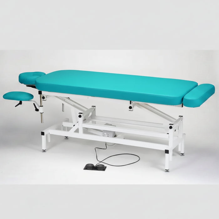 Standalone angled view of the blue Made in Canada A Lek Jupiter Electric Hi-Lo Massage Table, featuring a sturdy white metal frame, a foot pedal control for smooth height adjustment, and an integrated foot extension for professional clinic use.