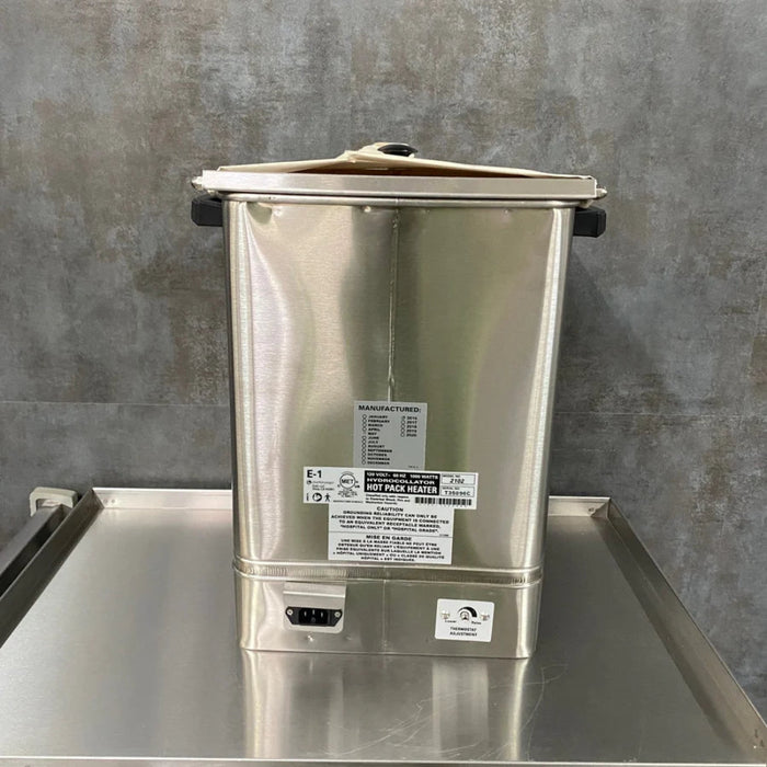 Back view of the E-1 heating unit, highlighting its high-quality stainless steel construction and compact footprint for clinical use.