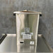 Back view of the E-1 heating unit, highlighting its high-quality stainless steel construction and compact footprint for clinical use.