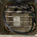 A technical view of the internal storage rack and the set of six moist heat packs included with the E2 unit for professional treatment environments.