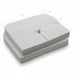 A bulk stack of 100 white disposable face cradle covers, providing a convenient hygiene solution for high-volume wellness practices.