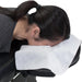 A lifestyle image of a client in the prone position using a disposable face rest cover, showcasing the comfortable fiber against the skin.