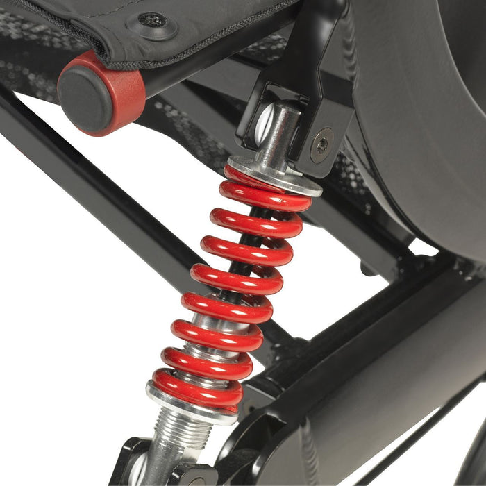 Close-up of Drive Nitro HD rollator rear coil spring suspension system for smooth ride on rough surfaces