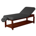 Angled standalone view of the black ET Series 30-inch Tilt Stationary Massage Table, featuring a durable European beech wood frame and an adjustable backrest designed for professional clinical use.