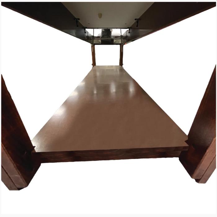 Close-up underneath the ET Series stationary massage table, highlighting its strong European beech wood construction and the practical lower storage shelf.
