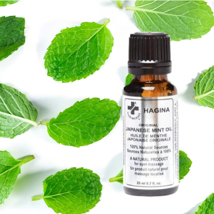 A lifestyle image featuring a bottle of HAGINA Japanese Mint Oil alongside fresh mint leaves, emphasizing its natural origin and purity.