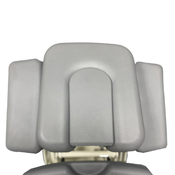 Gray padded face cradle cushion set with three rectangular pads for a massage or treatment table