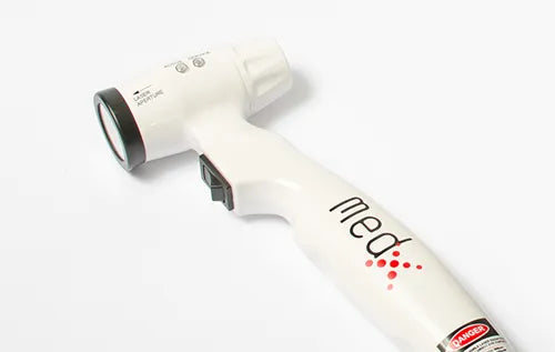 Med-X LCS450 handheld cold laser therapy device in white, shown from the side with red laser indicator and pistol grip design, from Therapy Supply