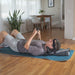 A lifestyle image showing a person in the supine position using the Saunders device, illustrating how it provides clinical-style neck traction at home.