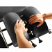 A lifestyle image demonstrating a practitioner performing a manual adjustment on the Series 260 table, highlighting its functional reliability.