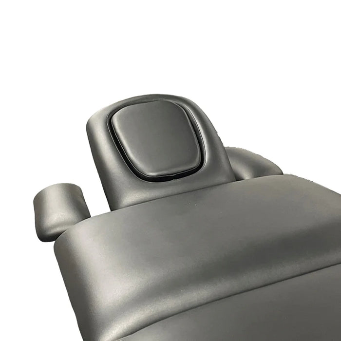 Treatment table headrest section in gray upholstery showing the face cutout cushion for prone positioning, from Therapy Supply