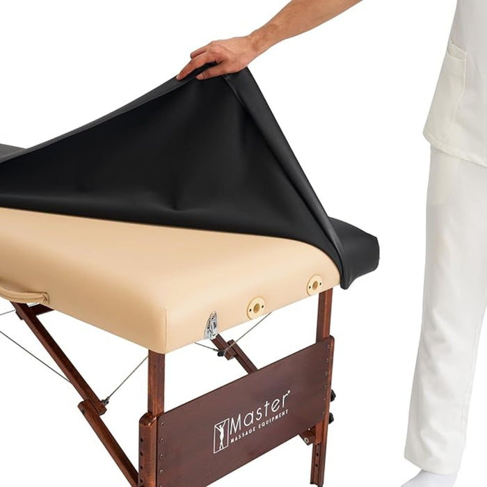Demonstration of the fitted cover being applied to the corner of a treatment table, showing its flexibility and ease of use.