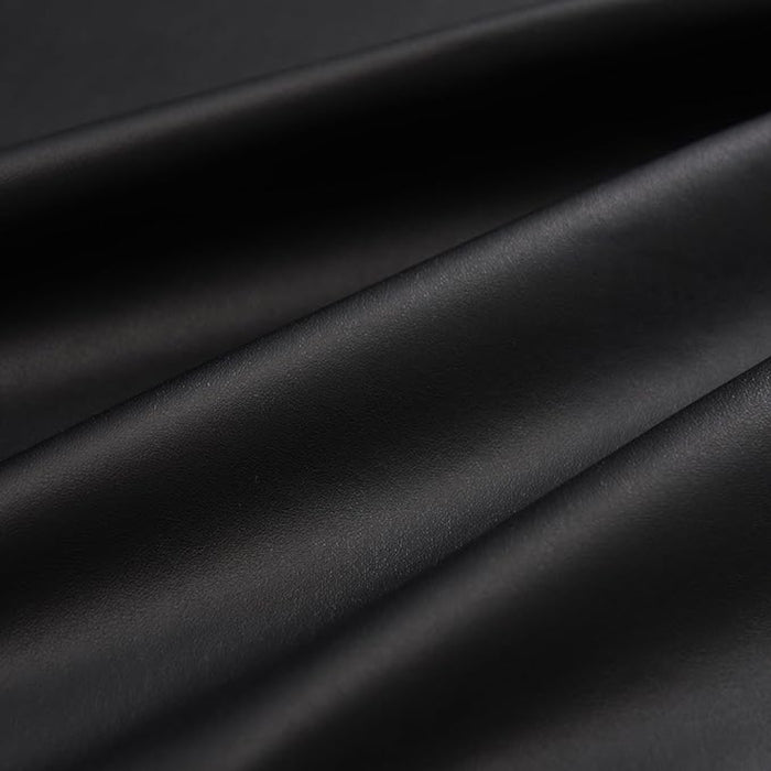 A view of the smooth, professional black finish of the fitted PU vinyl cover, designed to extend the life of massage table upholstery.
