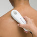 A lifestyle demonstration showing the US 1000 3rd Edition being used for therapeutic ultrasound treatment on a patient's shoulder.