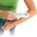 The US 1000 portable ultrasound unit being applied to the waist area, demonstrating its use for targeted soft-tissue therapy routines.