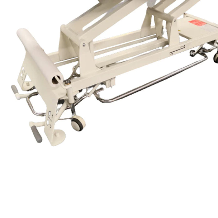 Walk-free base treatment table frame showing the cream colored lifting mechanism, foot pedals, and underside design, from Therapy Supply