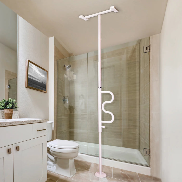 Wonder Pole model 1100 floor-to-ceiling tension-mounted support pole in white, installed in a bathroom next to a toilet and walk-in shower with curved S-shaped handle, from Therapy Supply