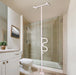 Wonder Pole model 1100 floor-to-ceiling tension-mounted support pole in white, installed in a bathroom next to a toilet and walk-in shower with curved S-shaped handle, from Therapy Supply