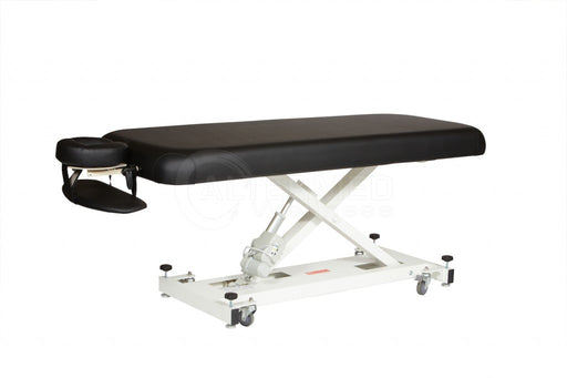 Angled standalone view of the black Athena Classic Electronic Massage Table, featuring a heavy-duty steel scissor-lift frame and lockable wheels designed for professional clinic environments.