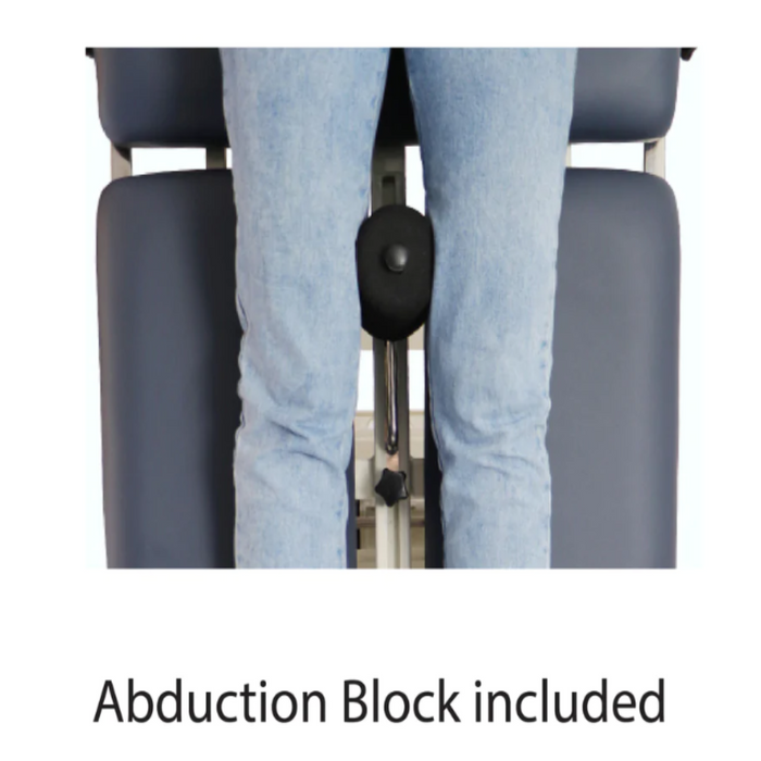 Close-up view of the black padded abduction block installed on the BF Series electric tilt table, demonstrated between a patient's legs to ensure proper hip and lower limb alignment.