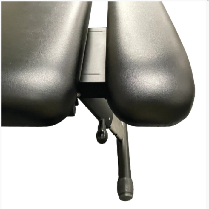 Close-up side view of the distinct gap between the thoracic and lumbar drop sections on the Series Stationary Chiropractic Drop Table 260, highlighting its precision engineering.