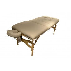 Full angled view of the tan Prenatal Portable Massage Table, handcrafted in Canada with a high-quality wooden frame and specialized cutouts for belly and breast comfort during mobile therapy sessions.