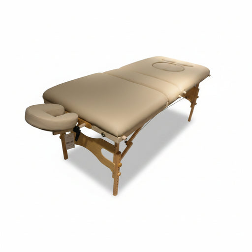 Full angled view of the tan Prenatal Portable Massage Table, handcrafted in Canada with a high-quality wooden frame and specialized cutouts for belly and breast comfort during mobile therapy sessions.