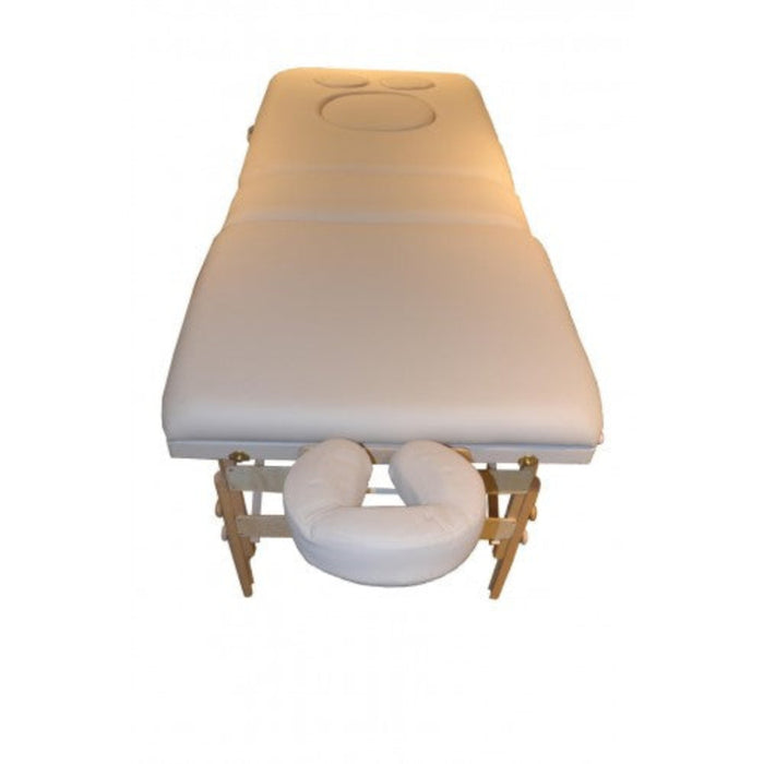 Top-down view of the table surface, clearly displaying the specialized, padded cutouts designed to provide maximum comfort and pressure relief for pregnant clients during therapy.